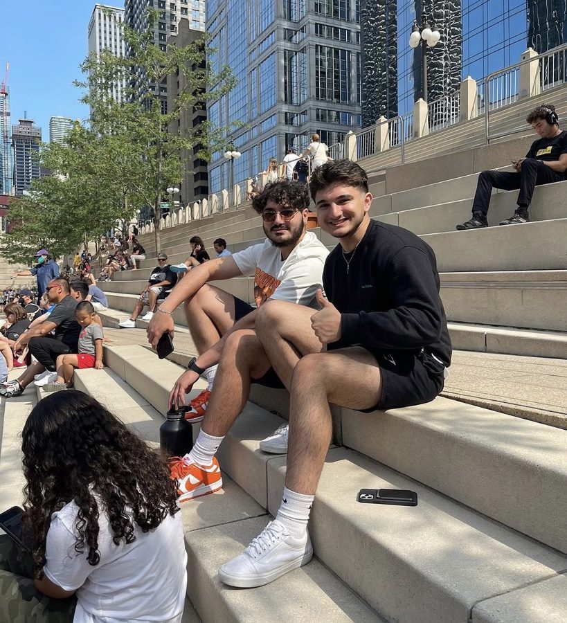 Abdul with a friend on the Chicago Riverwalk steps